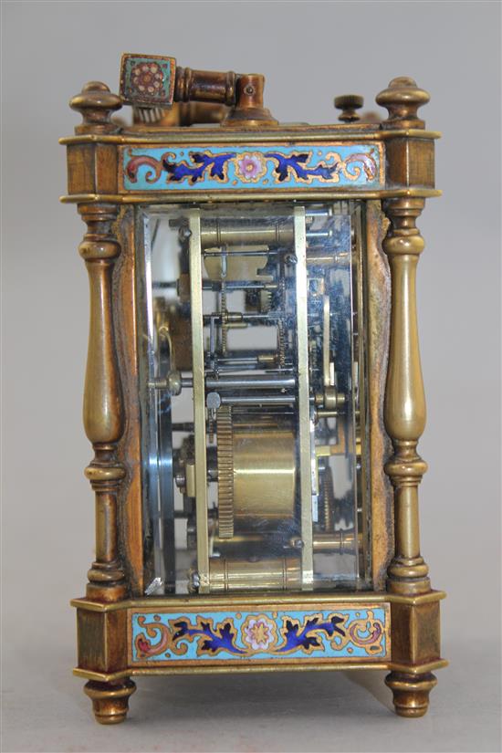 A late 19th century French gilt brass and champleve enamel hour repeating carriage alarum clock, 4.75in., with travelling case